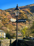 Beddgelert bridge sign post. Greetings card