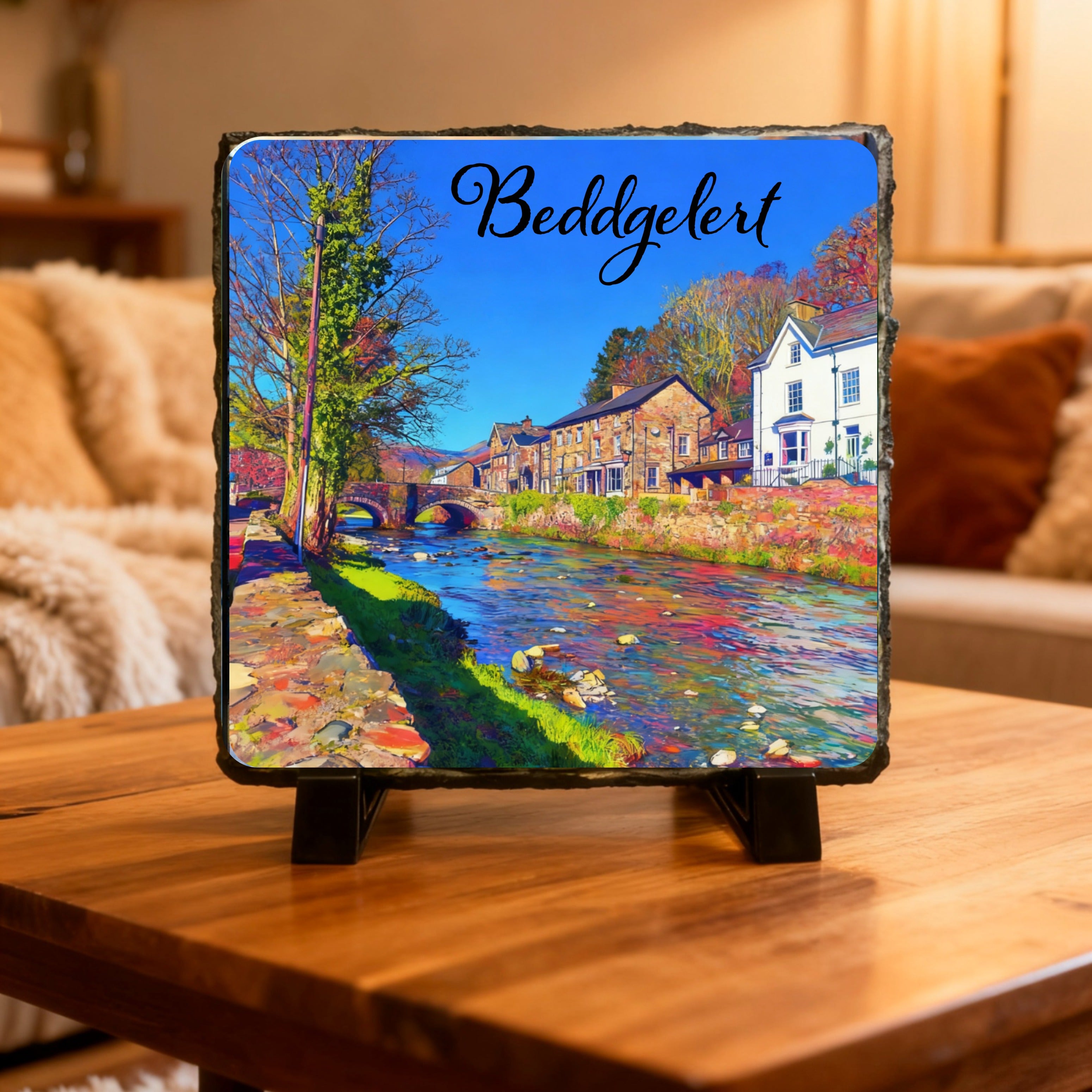 image on slate, comes with stands and boxed. 14cm x 14cm Beddgelert and Watkin Pool.